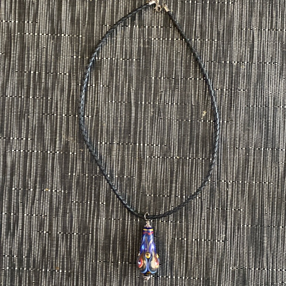 Hand made necklace. Black “string style “ with hand made glass type bead.